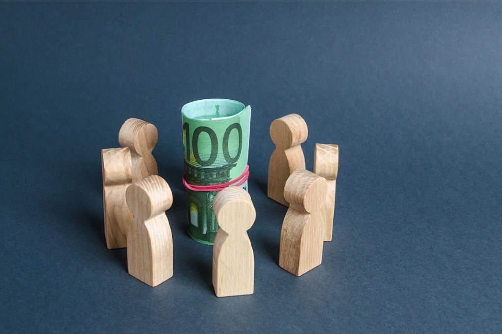 circle-of-people-surround-a-bundle-of-euro-money-crowdfunding-budget-picture-id1193706313.jpg?w=1024